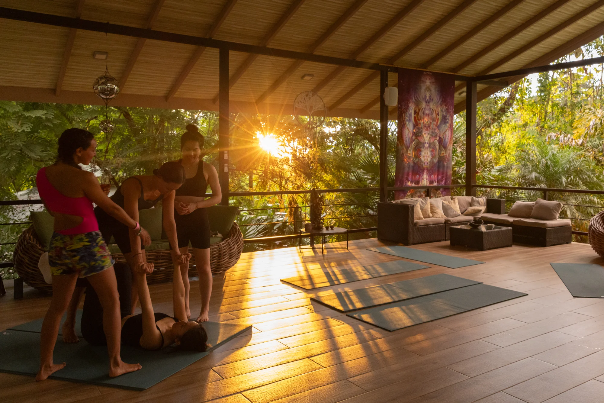 Acro yoga in the Yoga Chalet at sunset