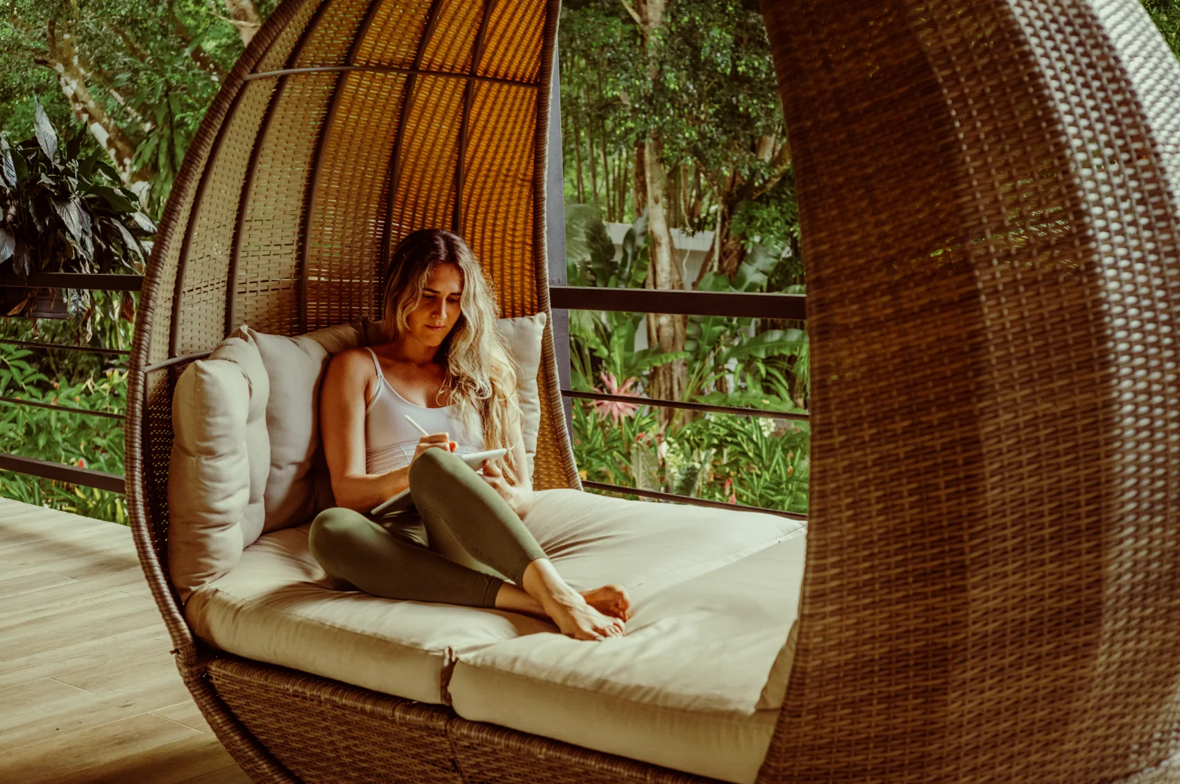 Writing in a hanging chair above the gardens